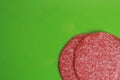 Close up shot of slices of salami in colorful background