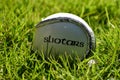 Close up shot of a sliotar on a grass pitch,used in the sport of hurling Royalty Free Stock Photo