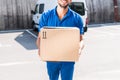 Delivery man with cardboard box Royalty Free Stock Photo