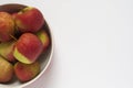 A bowl of apples on a white background