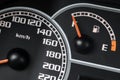 Close up shot of a speed meter and fuel gage in a car Royalty Free Stock Photo