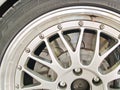 A close up shot of a sports car wheel and brakes