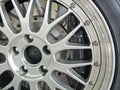 A close up shot of a sports car wheel and brakes