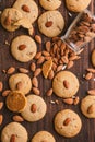 Close-up shot of a stack of freshly baked cookies with almonds.