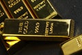 Close up shot of stacked 999.9 pure gold bar ingot on a black background Royalty Free Stock Photo