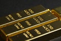 Close up shot of stacked 999.9 pure gold bar ingot on a black background Royalty Free Stock Photo