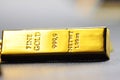 Close up shot of stacked 999.9 pure gold bar ingot on a black background Royalty Free Stock Photo