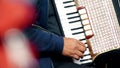 Close-up shot of a street musician`s hand playing the accordion. Paris, France Royalty Free Stock Photo
