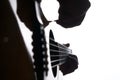 Close up shot of strings and guitarist hands playing acoustic guitar