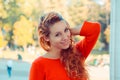 Close up shot of stylish young woman smiling looking at you camera city park on background. Beautiful female model with copy space Royalty Free Stock Photo