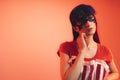 close-up shot tantalizing big-eyed European girlfriend in a mask looks softly and sensually at the camera pink Royalty Free Stock Photo