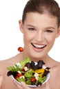 I enjoy salad... FOR REAL. Close-up shot of a teenage girl holding a bowl of healthy salad. Royalty Free Stock Photo