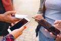 Close up shot of teenager group of people using their phones outdoor Royalty Free Stock Photo