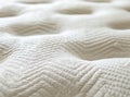 A close-up shot of the texture and pattern on a mattress, highlighting its softness and comfort for sleeping. The Royalty Free Stock Photo