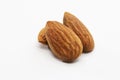 Close up shot of three roasted almonds Royalty Free Stock Photo