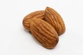 Close up shot of three roasted almonds Royalty Free Stock Photo