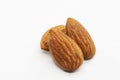 Close up shot of three roasted almonds Royalty Free Stock Photo