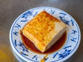 Close up shot of tofu with sauce