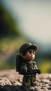 Close up shot of a toy soldier in a uniform, standing on a rock Royalty Free Stock Photo