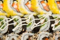 Close-up shot of traditional fresh japanese sushi rolls, focus on the front piece