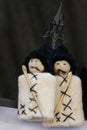 Close up shot of traditional hnadmade Georgian dolls in a blurry background