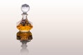 Close Up Shot Of Traditional Luxury Arabic Oud orange Oil Perfume In A Beautiful Handmade Clear Crystal Glass Jar Bottle and Royalty Free Stock Photo