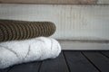 Close-up shot of two knitted from natural wool sweaters, on a black wooden table, selective focus