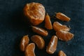 peeled oranges on a table with one cut in half Royalty Free Stock Photo