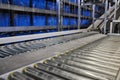 Close up shot of two roller conveyors in an automated warehouse in Germany