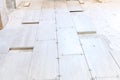 Close up shot of unfinished floor tiles installation in kitchen Royalty Free Stock Photo