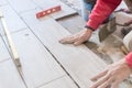 Close up shot of unfinished floor tiles installation in kitchen Royalty Free Stock Photo