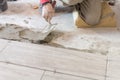 Close up shot of unfinished floor tiles installation in kitchen Royalty Free Stock Photo