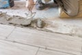 Close up shot of unfinished floor tiles installation in kitchen Royalty Free Stock Photo