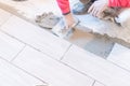 Close up shot of unfinished floor tiles installation in kitchen Royalty Free Stock Photo