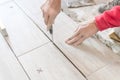 Close up shot of unfinished floor tiles installation in kitchen Royalty Free Stock Photo