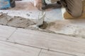 Close up shot of unfinished floor tiles installation in kitchen Royalty Free Stock Photo