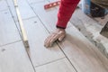 Close up shot of unfinished floor tiles installation in kitchen Royalty Free Stock Photo