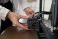 Engineer Hands Moving Extruder of 3D printer