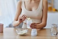 Woman Preparing Infant Formula in Bottle Royalty Free Stock Photo