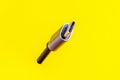 This close-up shot of a USB-C cable against a vibrant yellow backdrop is ideal for tech-related projects Royalty Free Stock Photo