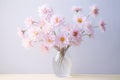 a close up shot of the vase having light pink flowers