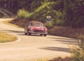Close-up shot of a vintage red Mercedes-Benz SL 3000 sports car during the race in Italy Royalty Free Stock Photo