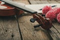 Close-up shot violin orchestra instrumental with vintage tone processed over wooden background select focus shallow depth of field Royalty Free Stock Photo