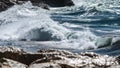 Close up shot of waves in the rocky coast of Mediterranean sea during summer Royalty Free Stock Photo