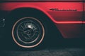 A close-up shot of the wheel red Ford Thunderbird. Retro car show, Saint-Petersburg, Russia, 26 may 2022. Royalty Free Stock Photo