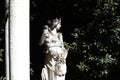 Close up shot of a white marble statue of a female in a garden Royalty Free Stock Photo