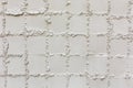 Close-up shot of white square ceramic pattern texture background