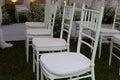 Close-up shot of white table and chairs, beautiful empty space decorated in a wedding Royalty Free Stock Photo