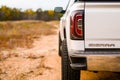 Close-up shot of a white truck in a field in North Carolina