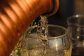 Close-Up Of White Wine Being Poured Into Wine Glass During Sunset Royalty Free Stock Photo